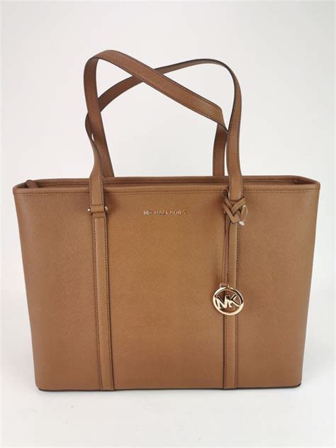 michael kors sady tote why is original cost 428|Michael Kors mk bag value.